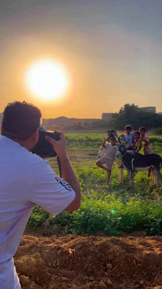 Filming outdoors at sunset.
